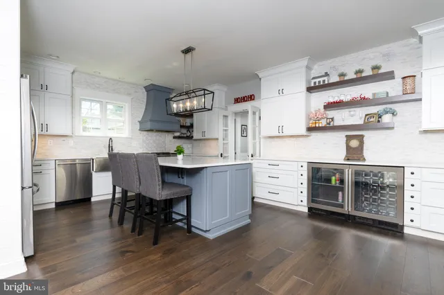 a kitchen with a table chairs and a stove