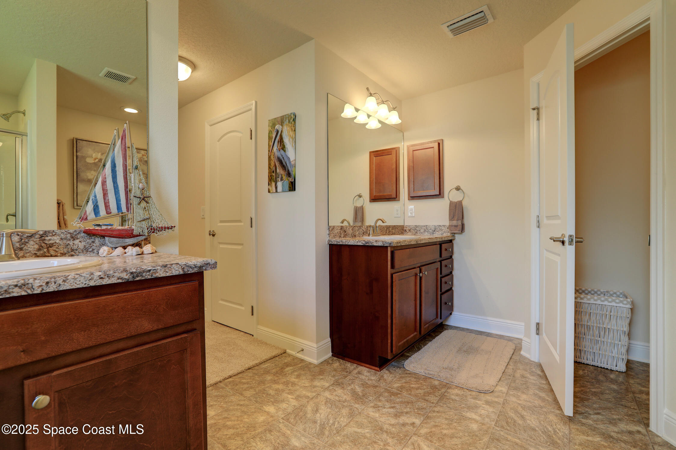 443 Lanfair Avenue Sebastian, FL 32958 - Photo 15 of 33 a bathroom with a granite countertop sink and a mirror