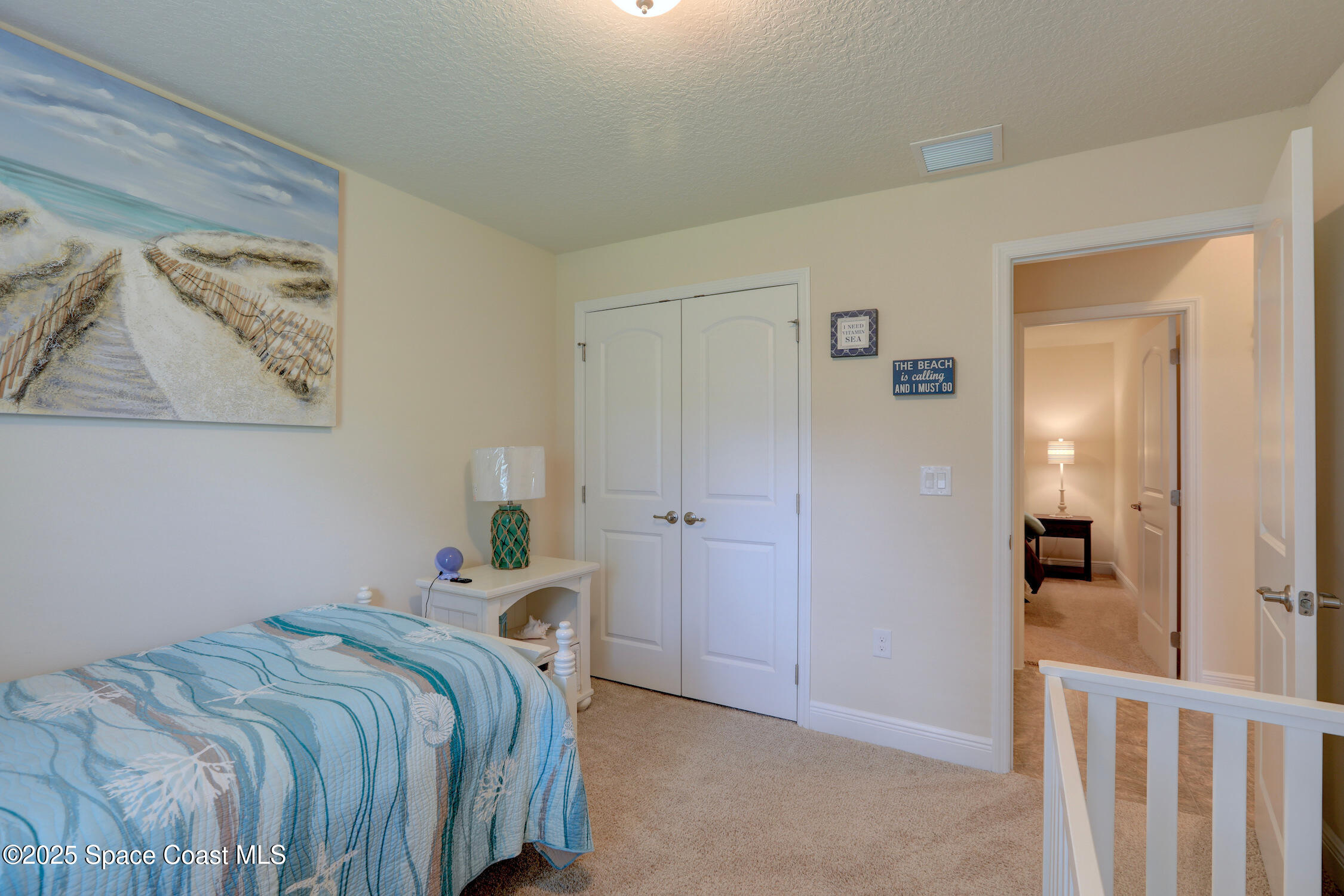 443 Lanfair Avenue Sebastian, FL 32958 - Photo 20 of 33 a bedroom with a bed and the view of bathroom