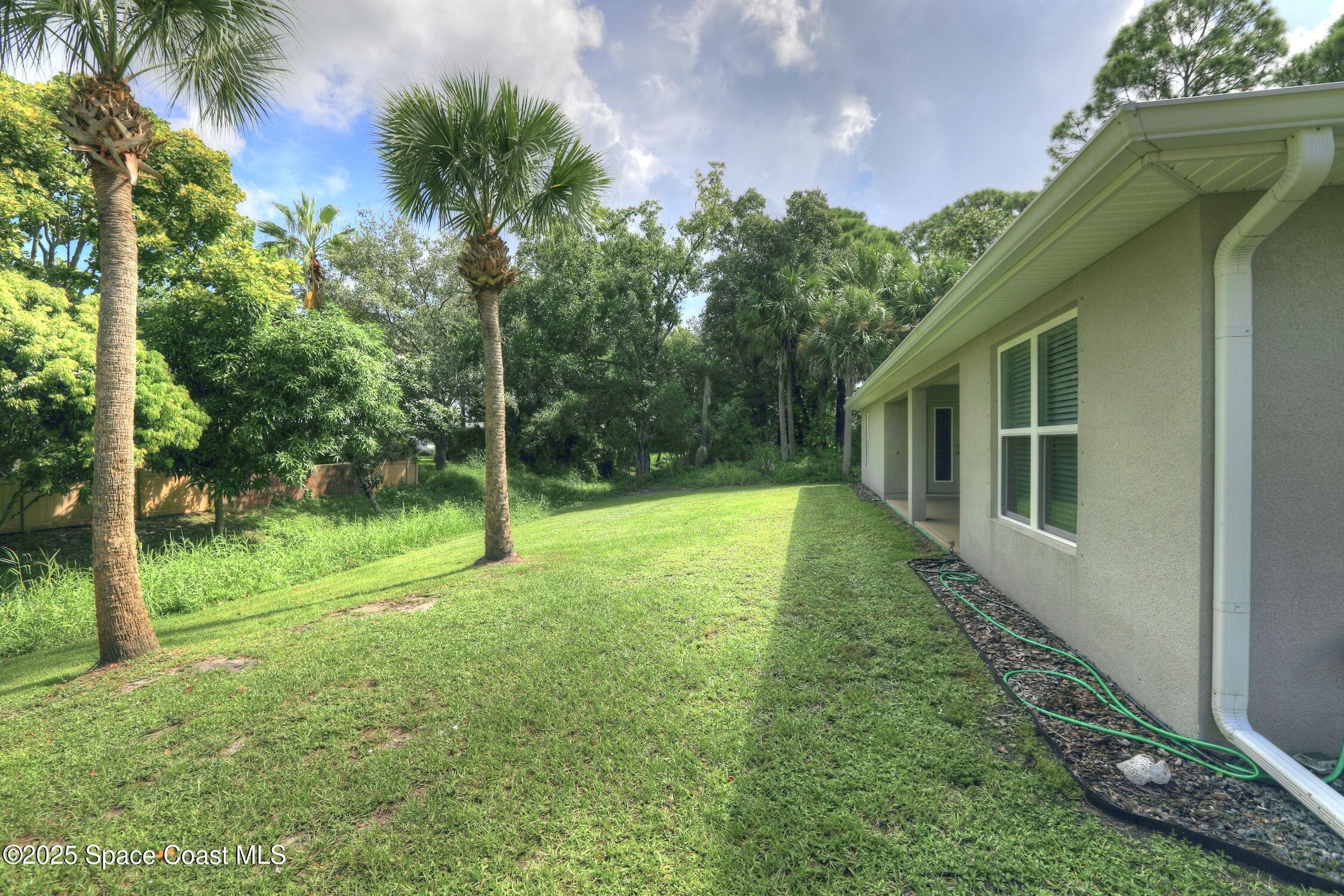 443 Lanfair Avenue Sebastian, FL 32958 - Photo 27 of 33 a view of a house with a backyard