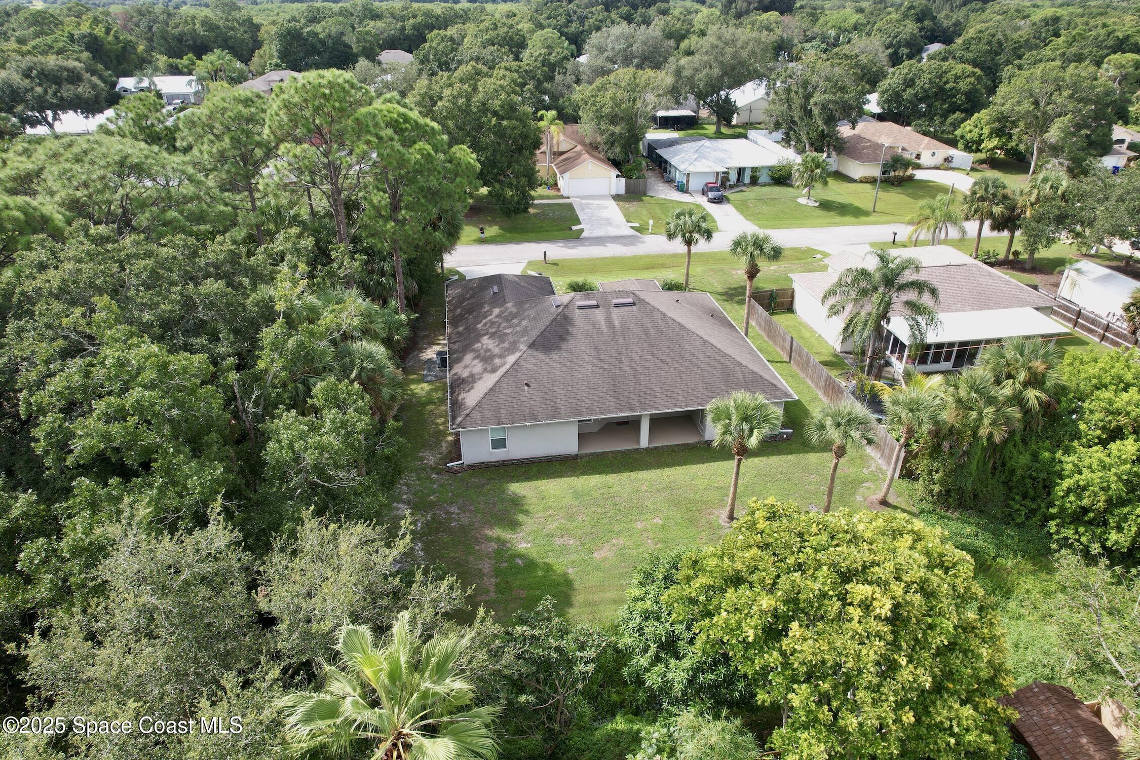 443 Lanfair Avenue Sebastian, FL 32958 - Photo 3 of 33 an aerial view of residential houses with outdoor space and trees