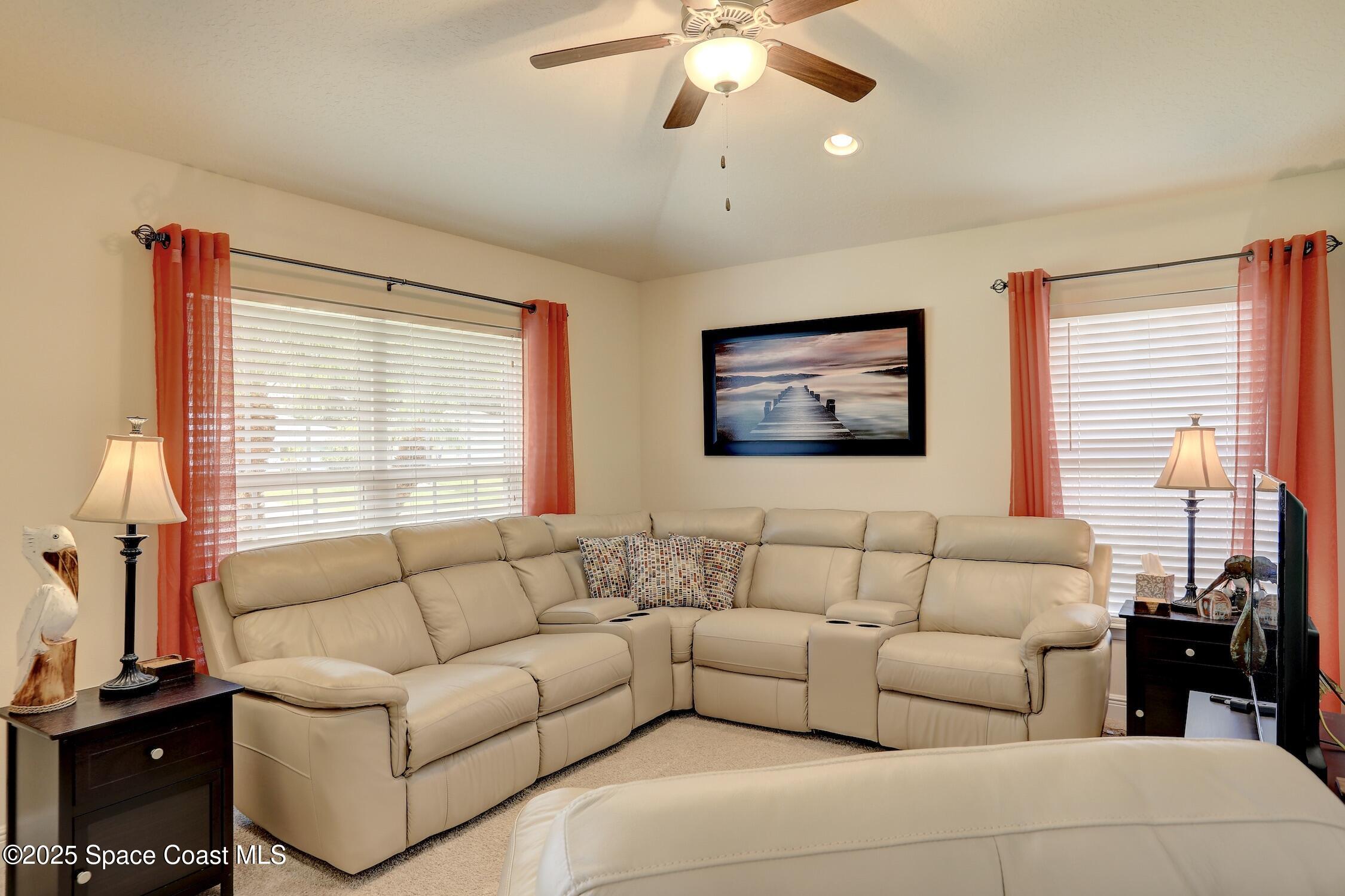 443 Lanfair Avenue Sebastian, FL 32958 - Photo 5 of 33 a living room with furniture and a large window