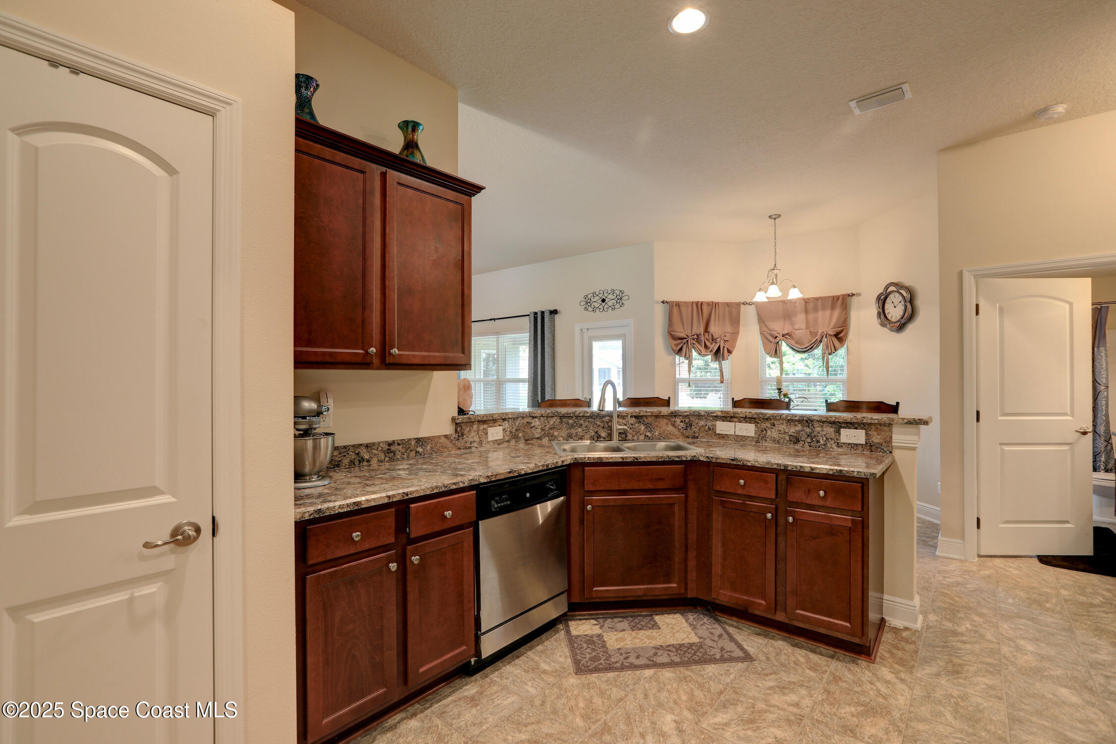 443 Lanfair Avenue Sebastian, FL 32958 - Photo 9 of 33 a kitchen with a sink and cabinets