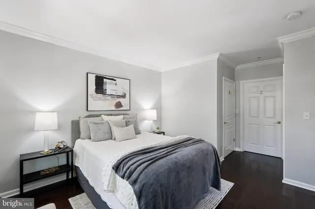 a bedroom with a bed and a night stand