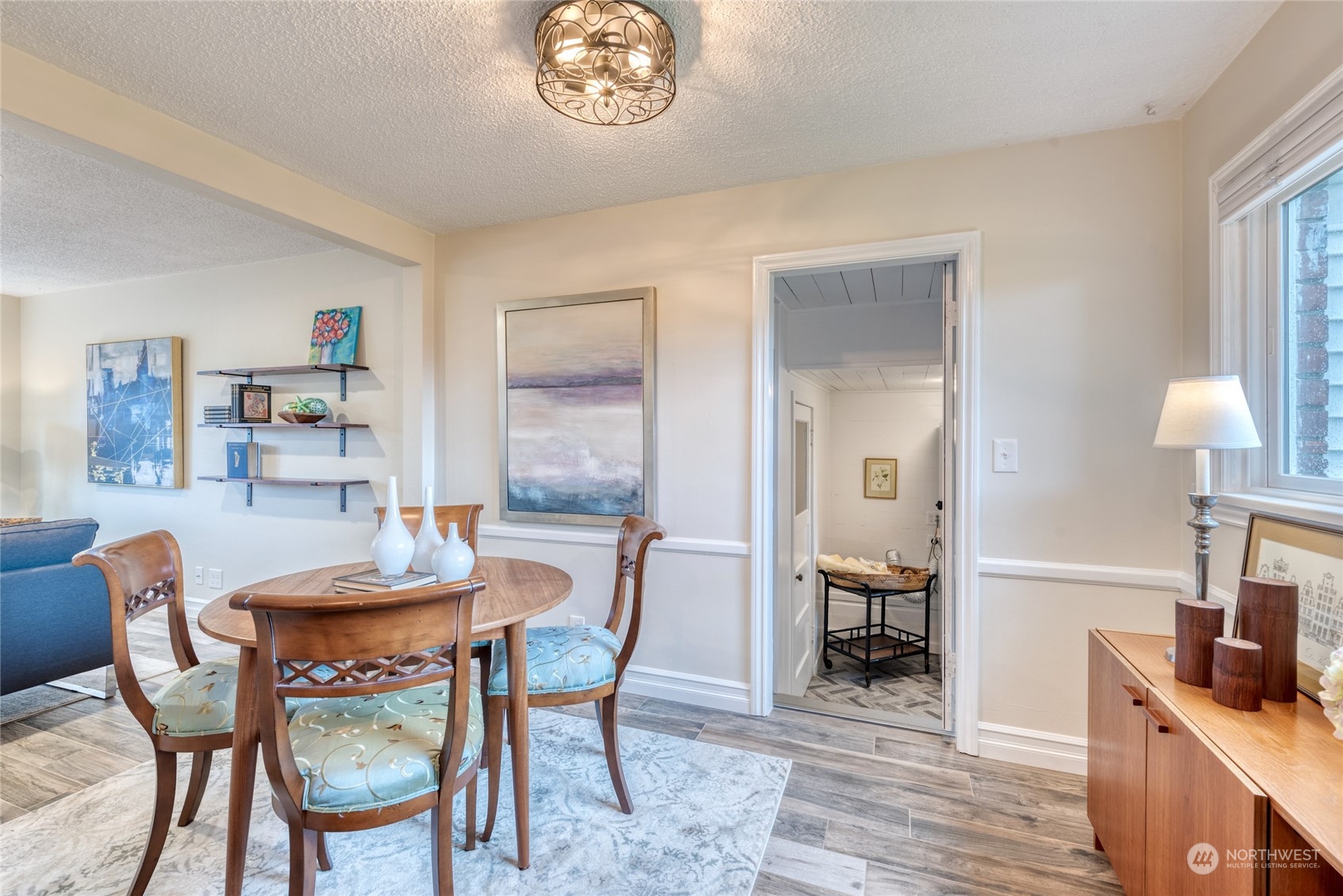 3915 Southwest Rose Street Seattle, WA 98136 - Photo 14 of 25 a view of a dining room with furniture and wooden floor