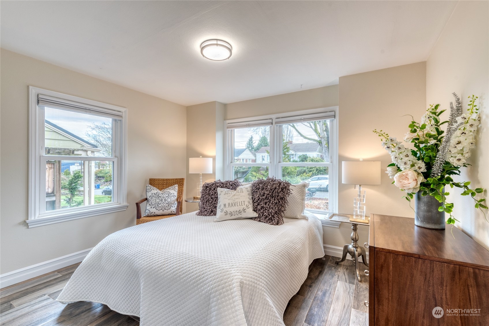 3915 Southwest Rose Street Seattle, WA 98136 - Photo 16 of 25 a bedroom with a large bed and a potted plant