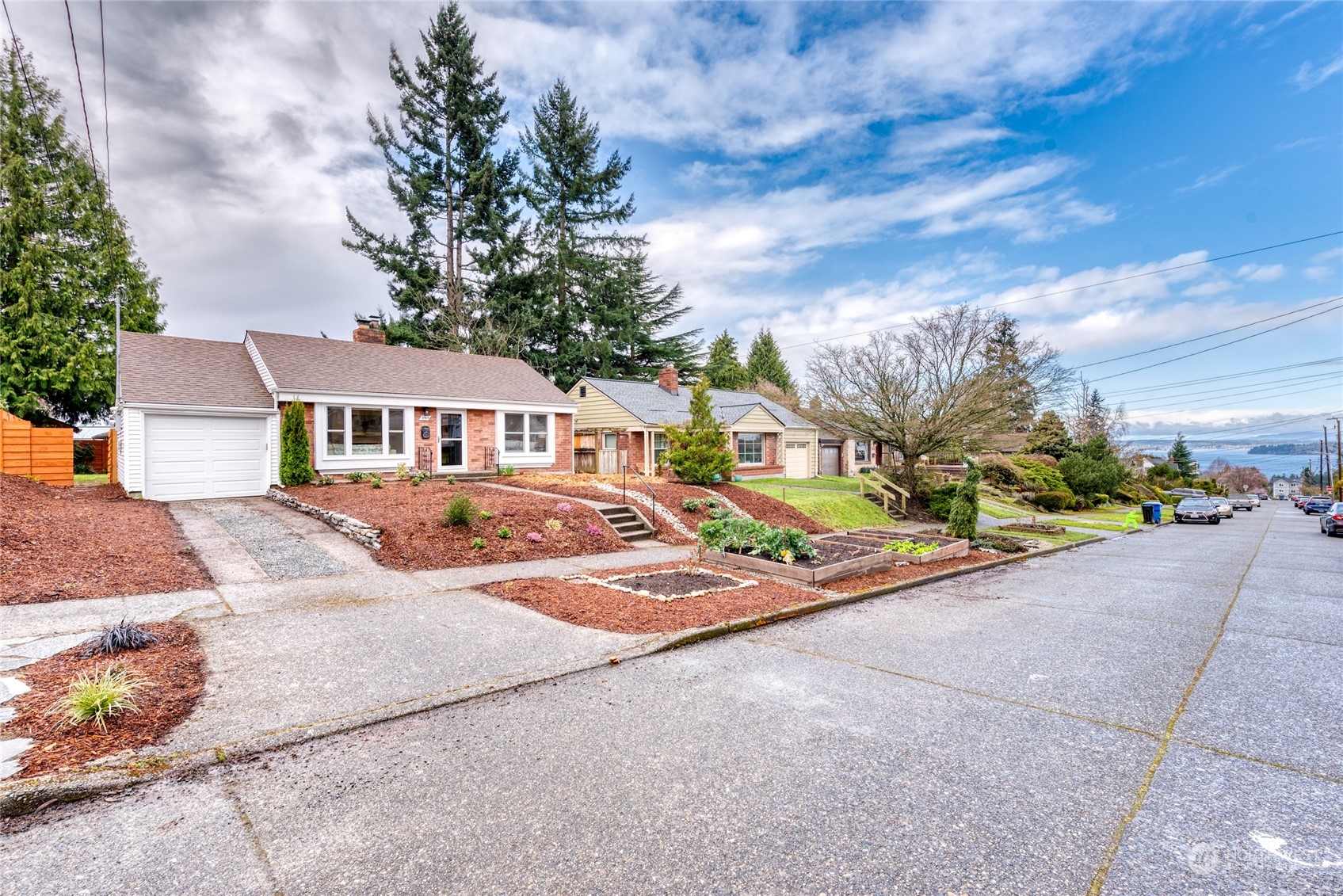 3915 Southwest Rose Street Seattle, WA 98136 - Photo 2 of 25 a view of house with outdoor space and parking