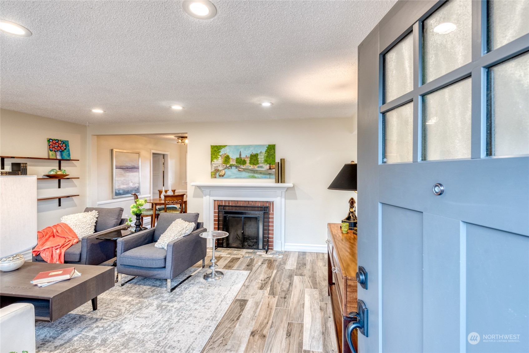 3915 Southwest Rose Street Seattle, WA 98136 - Photo 3 of 25 a living room with furniture fireplace and wooden floor