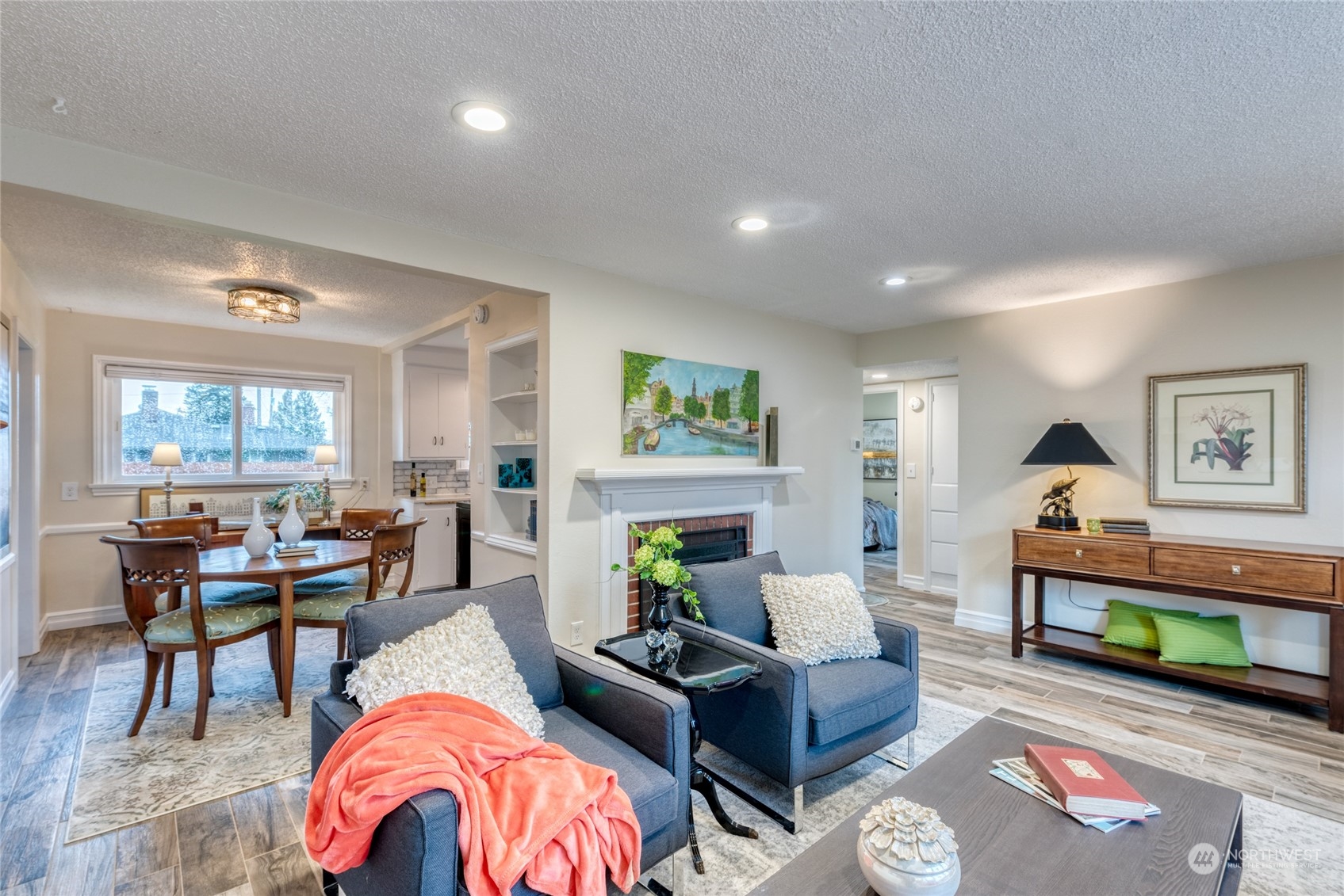 3915 Southwest Rose Street Seattle, WA 98136 - Photo 7 of 25 a living room with furniture a fireplace and a window