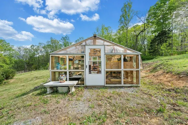 a kitchen with a sink cabinets and window