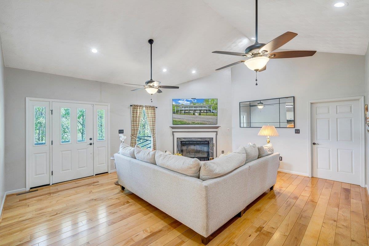 649 Greyledge Road Buchanan, VA 24066 - Photo 29 of 75 a living room with furniture and a chandelier