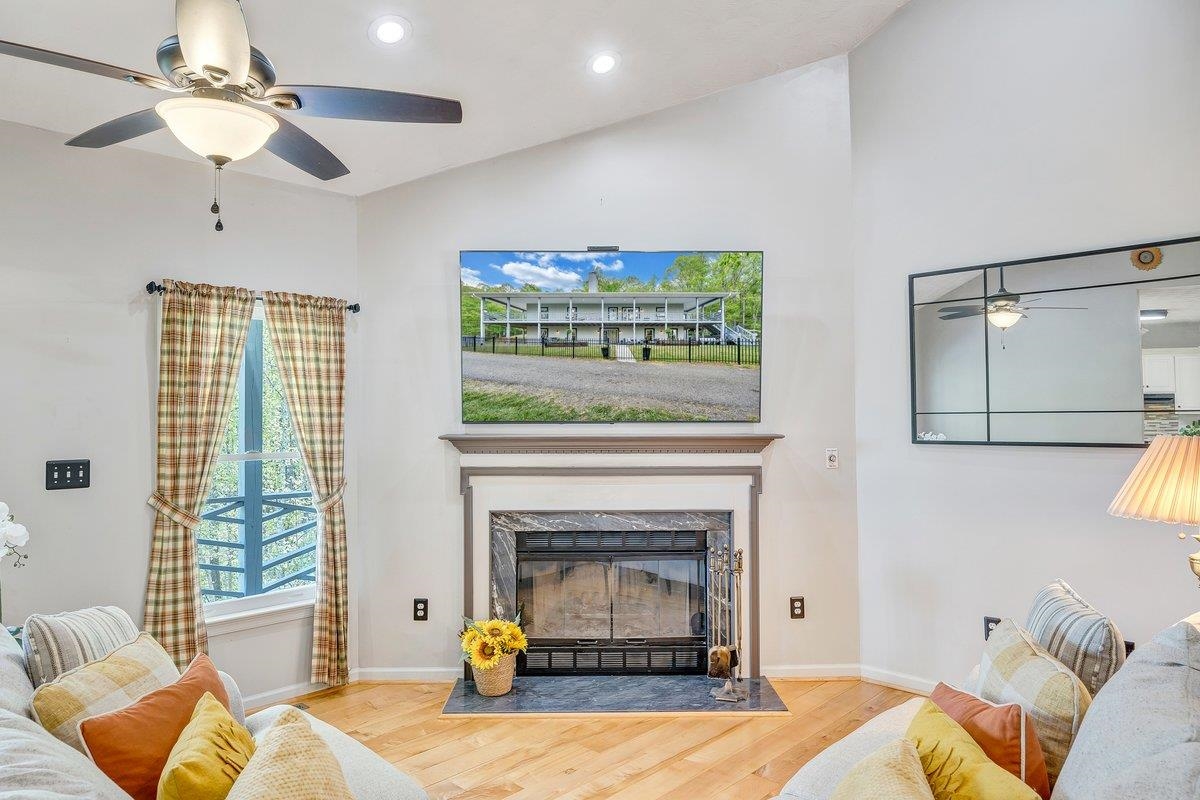 649 Greyledge Road Buchanan, VA 24066 - Photo 32 of 75 a living room with furniture and a fireplace