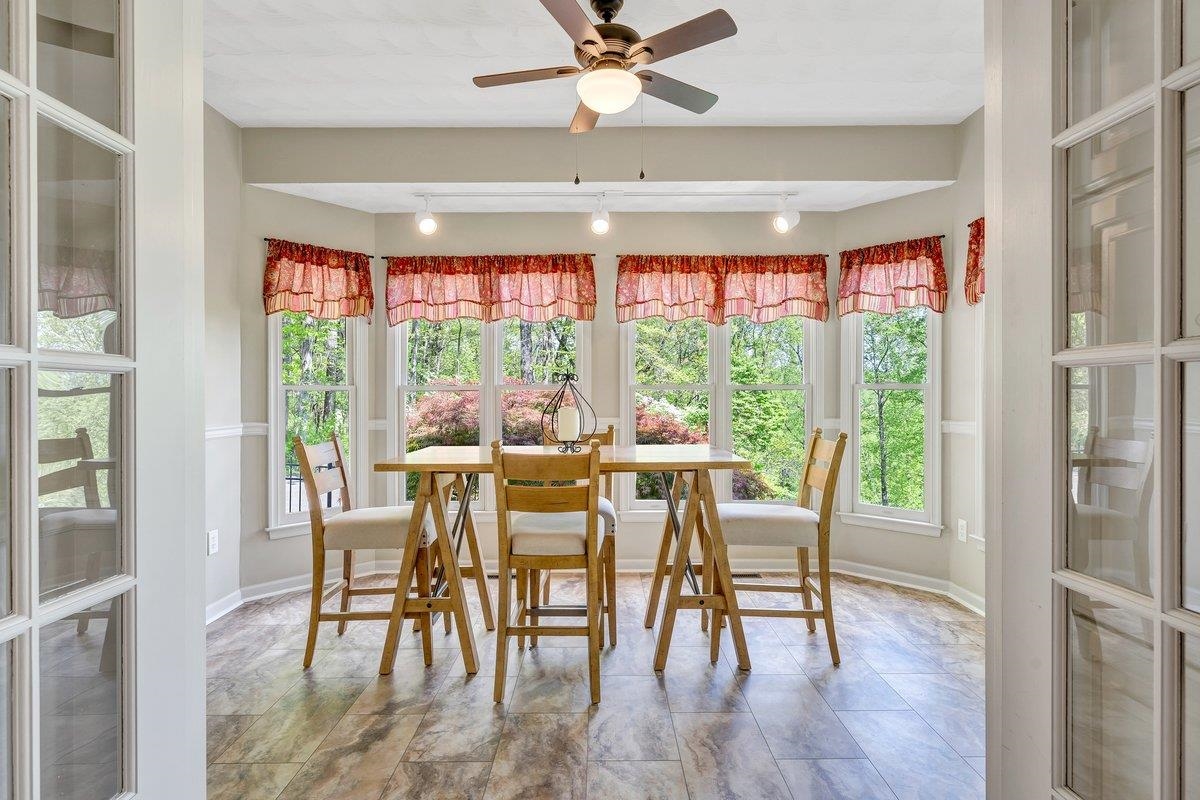 649 Greyledge Road Buchanan, VA 24066 - Photo 42 of 75 a dining room with furniture window and wooden floor