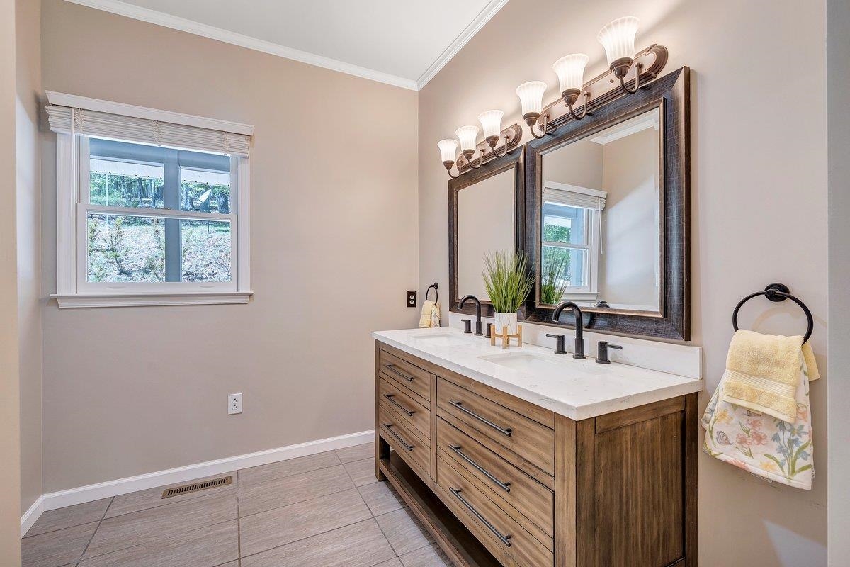 649 Greyledge Road Buchanan, VA 24066 - Photo 50 of 75 a bathroom with a double vanity sink mirror and