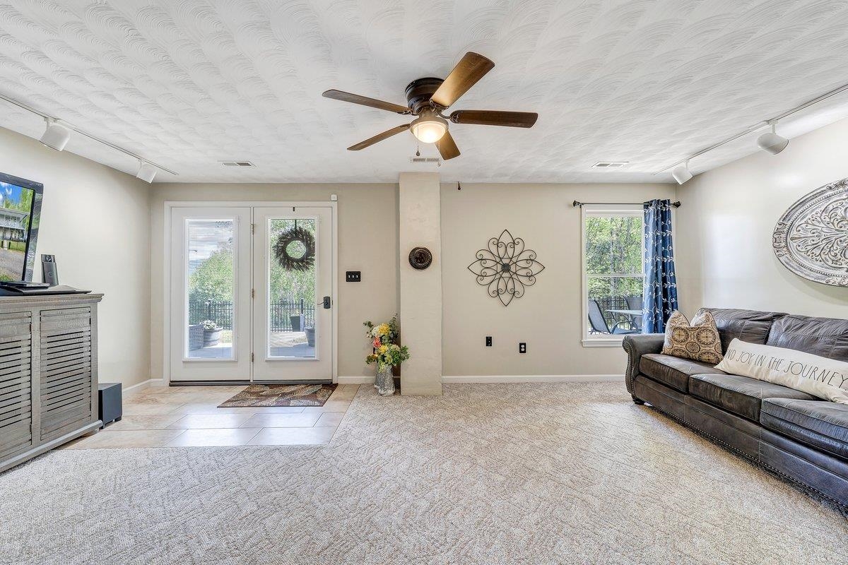 649 Greyledge Road Buchanan, VA 24066 - Photo 61 of 75 a living room with furniture and window with ceiling fan