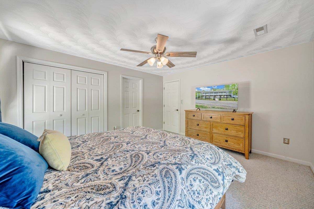 649 Greyledge Road Buchanan, VA 24066 - Photo 64 of 75 a bedroom with a bed and a dresser