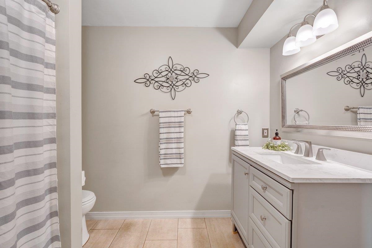 649 Greyledge Road Buchanan, VA 24066 - Photo 66 of 75 a bathroom with a sink a toilet and mirror