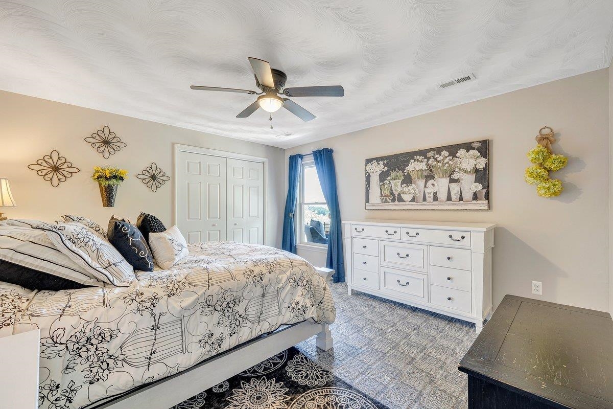 649 Greyledge Road Buchanan, VA 24066 - Photo 67 of 75 a bedroom with a bed and a painting on the wall