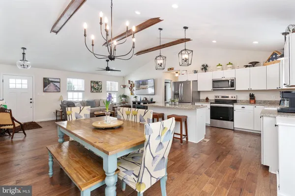 a view of kitchen with cabinets and wooden floor