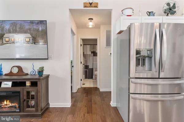 a view of kitchen with furniture and wooden floor