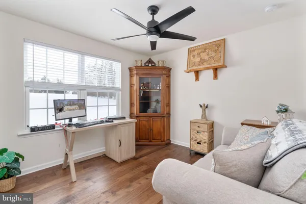 a living room with furniture and window