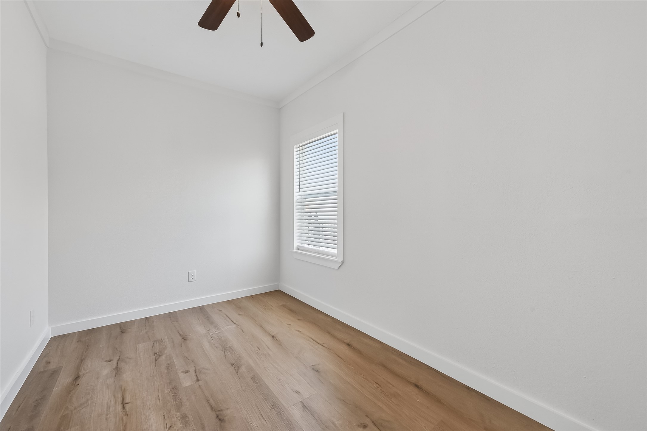 2202 Hutchins Street, Unit B Houston, TX 77003 - Photo 16 of 30 wooden floor in an empty room with a window
