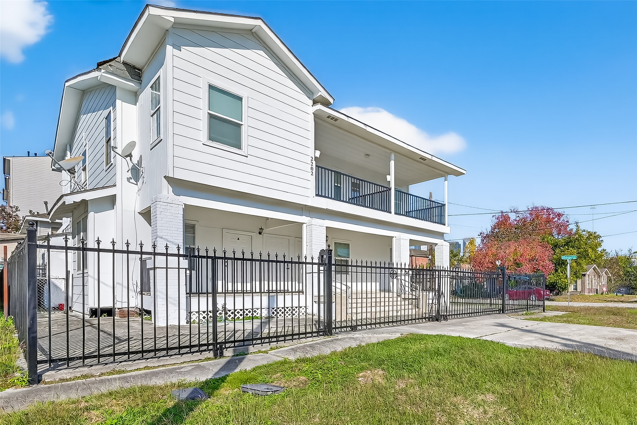 2202 Hutchins Street, Unit B Houston, TX 77003 - Photo 24 of 30 a view of a house with a yard and a garden