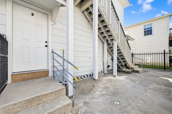 a view of a building with a small yard