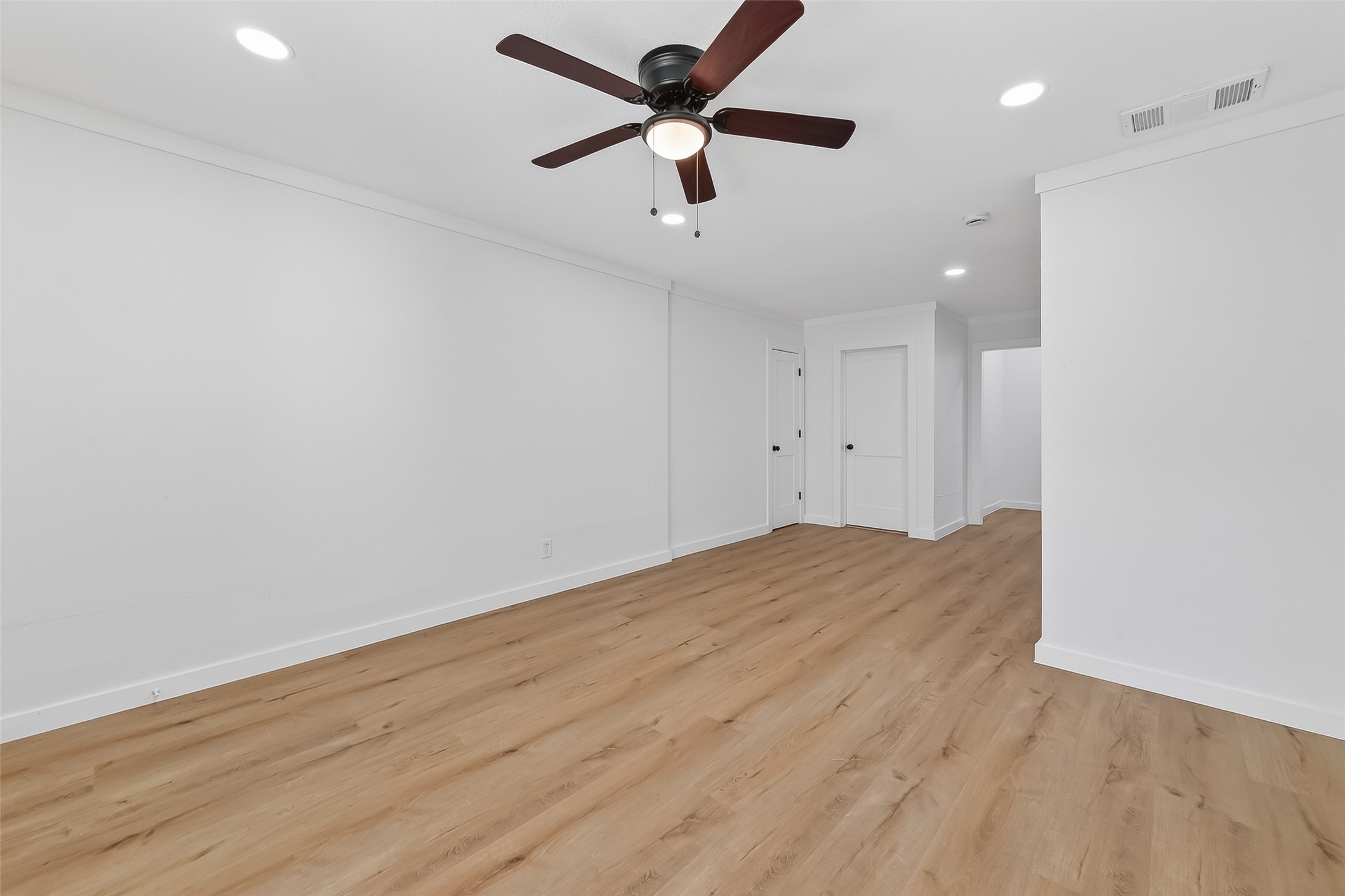 2202 Hutchins Street, Unit B Houston, TX 77003 - Photo 8 of 30 a view of empty room with wooden floor and ceiling fan