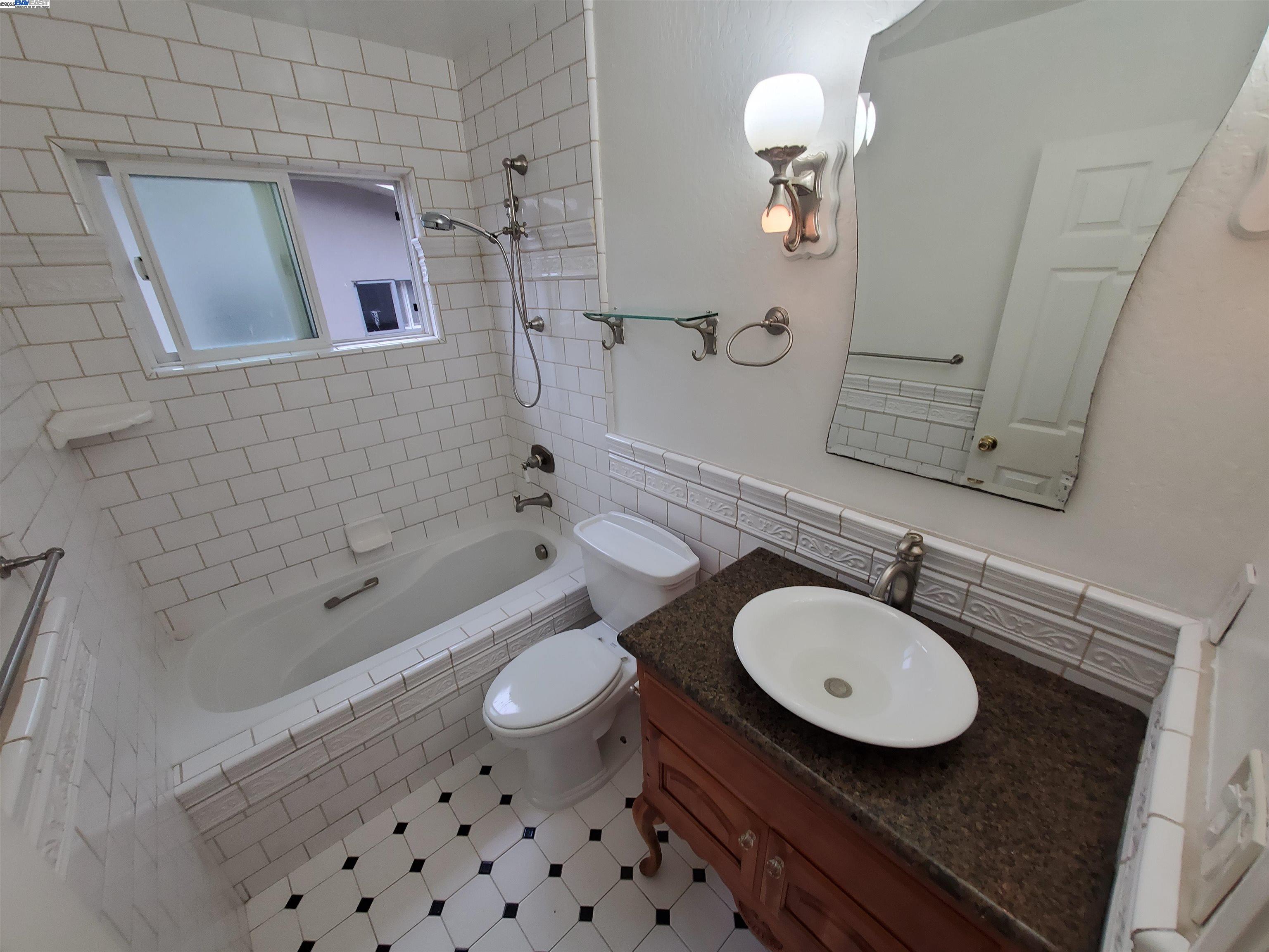 18425 Joseph Drive Castro Valley, CA 94546 - Photo 16 of 24 a bathroom with a sink a toilet and shower