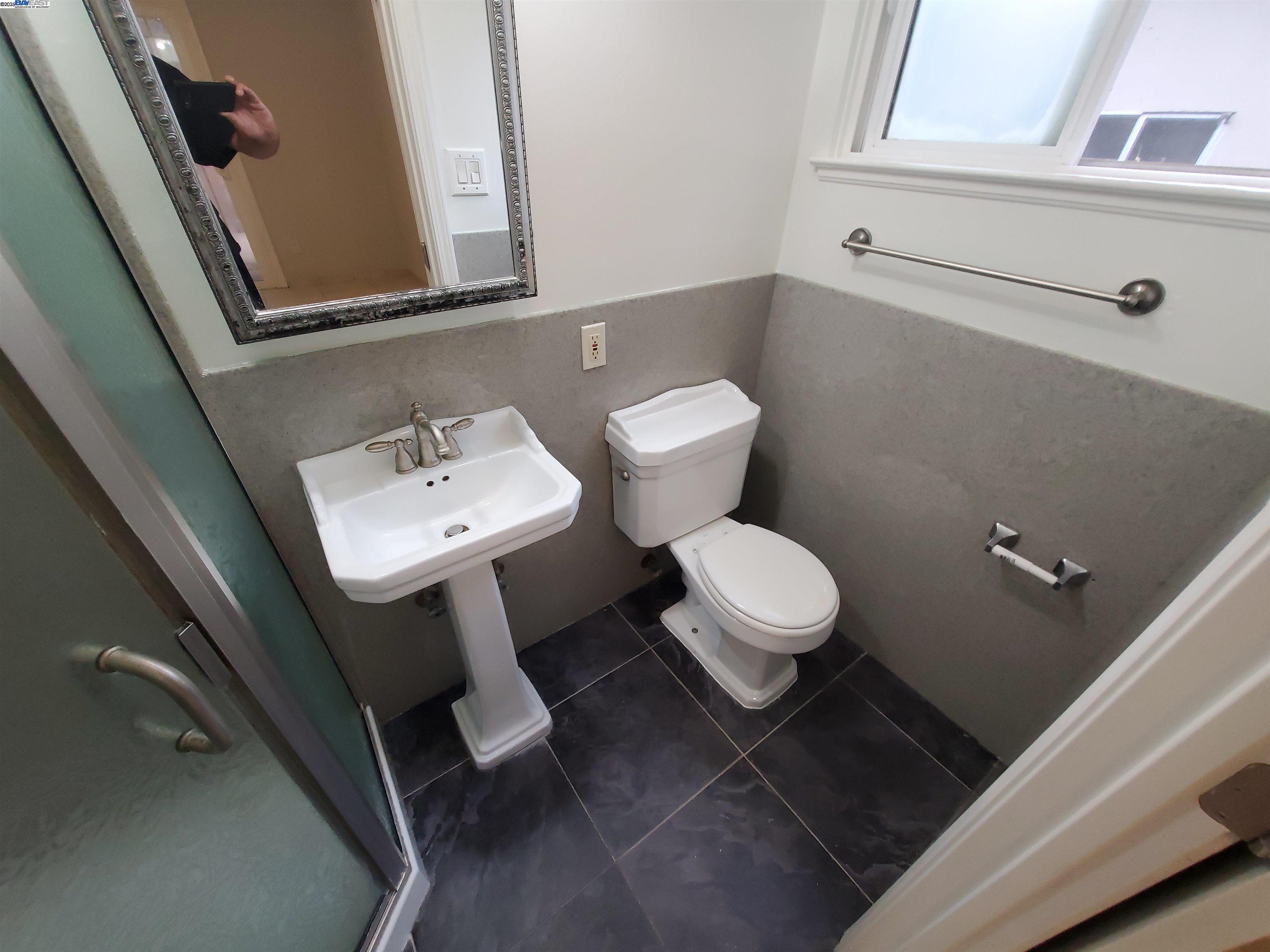 18425 Joseph Drive Castro Valley, CA 94546 - Photo 18 of 24 a white toilet sitting next to a bathroom sink