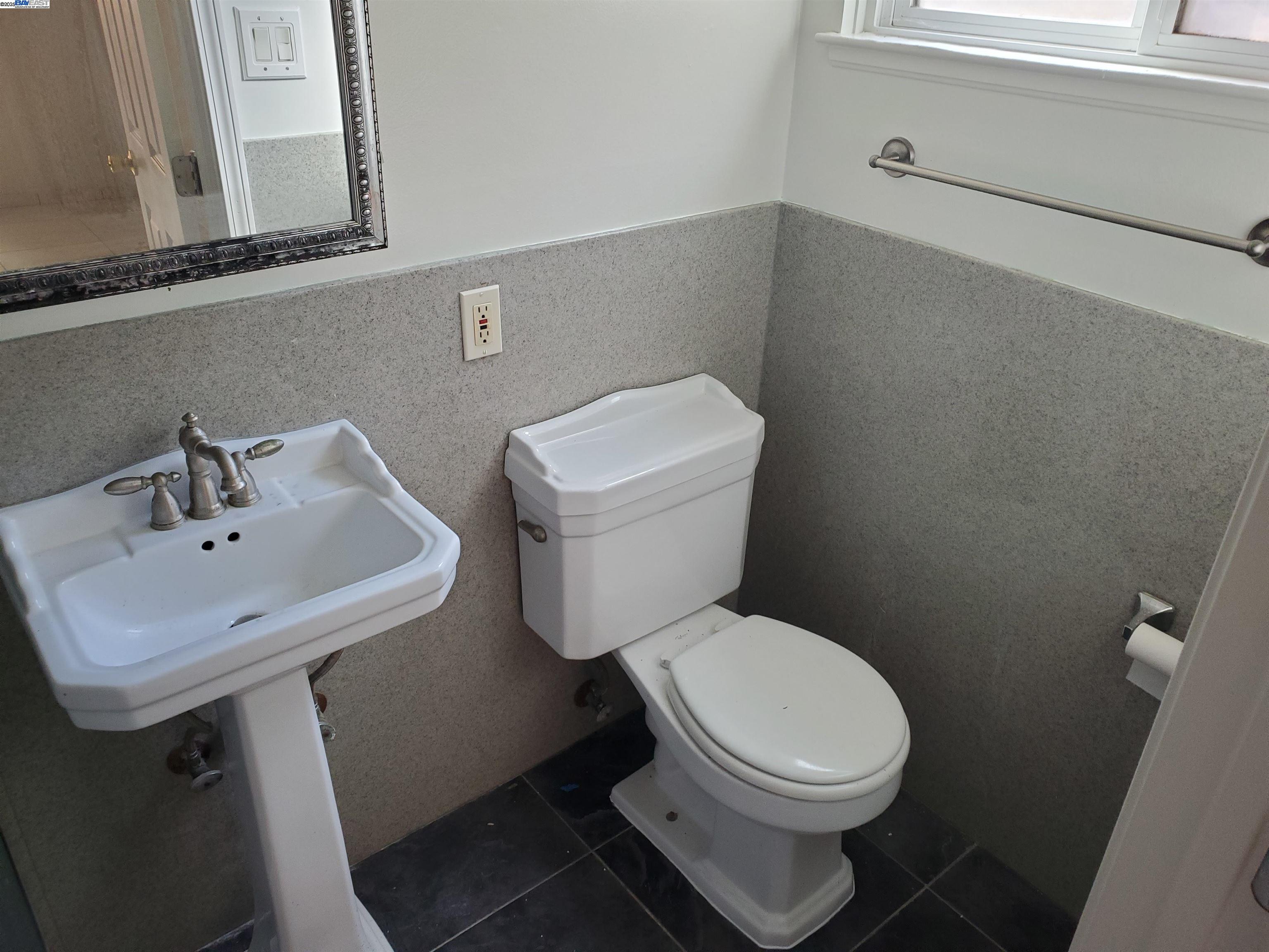 18425 Joseph Drive Castro Valley, CA 94546 - Photo 19 of 24 a white toilet sitting next to a bathroom sink