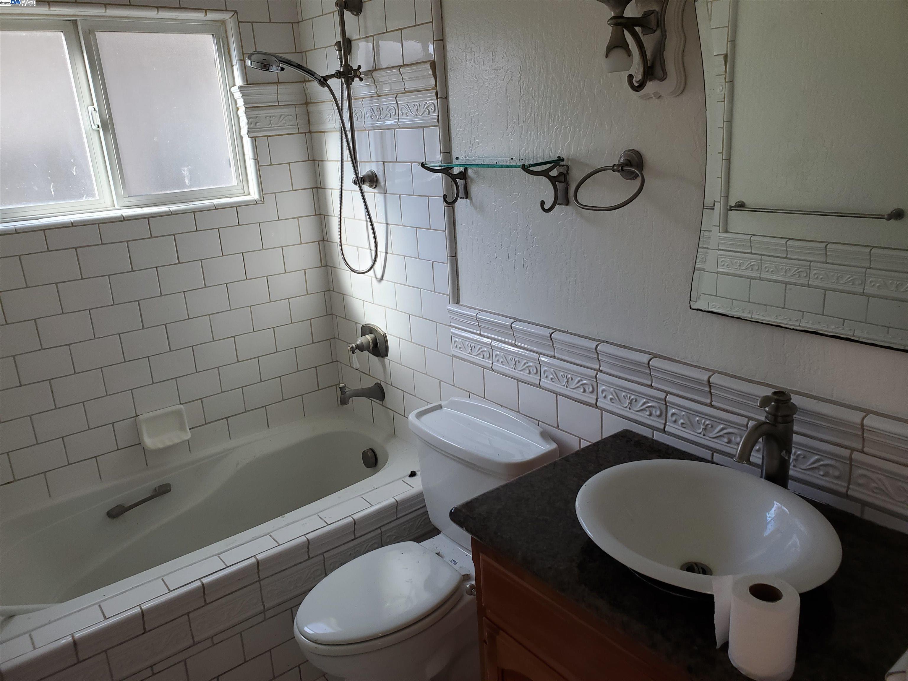 18425 Joseph Drive Castro Valley, CA 94546 - Photo 20 of 24 a bathroom with a sink toilet and shower