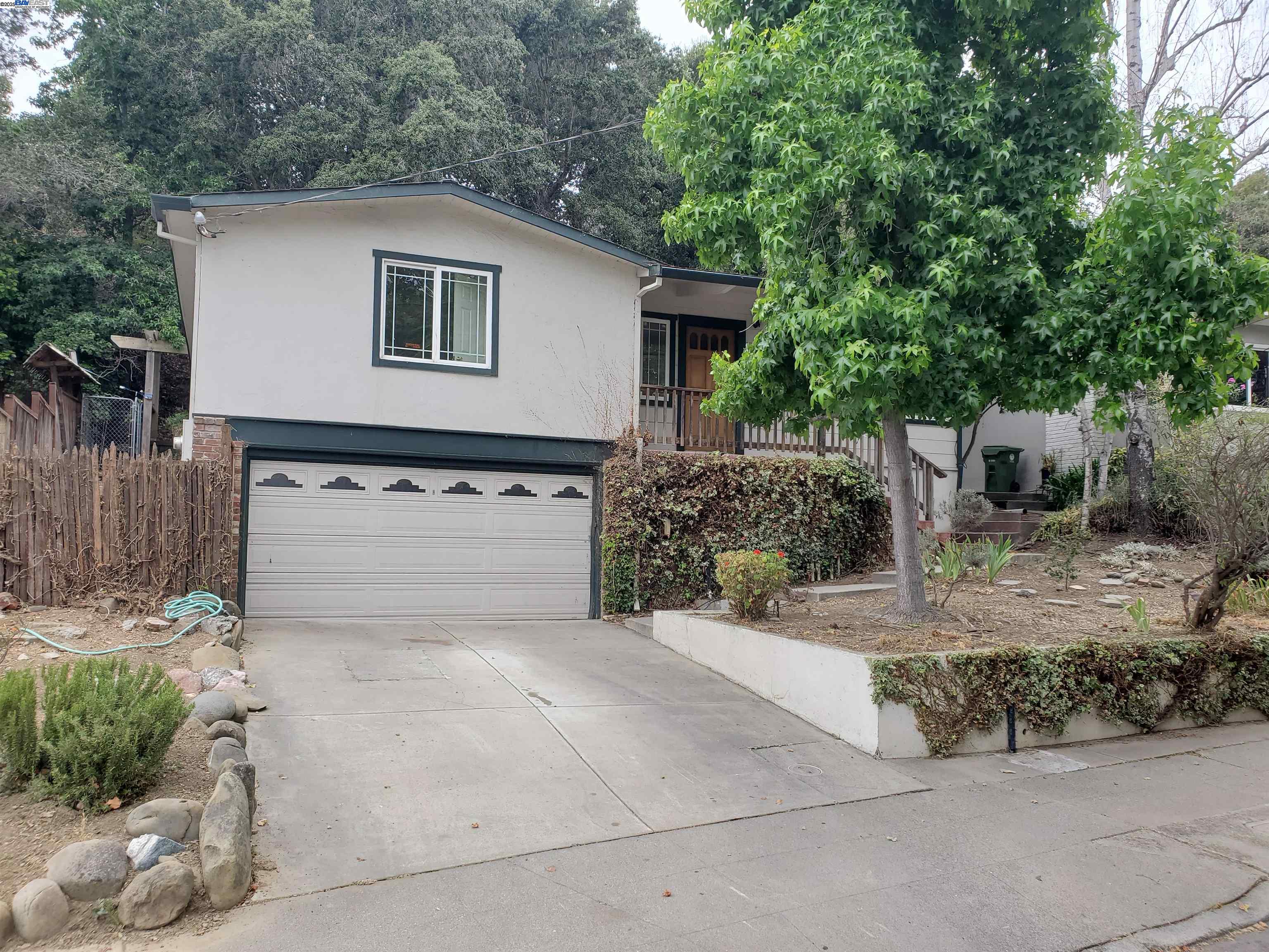 18425 Joseph Drive Castro Valley, CA 94546 - Photo 2 of 24 a view of a house with a yard and garage