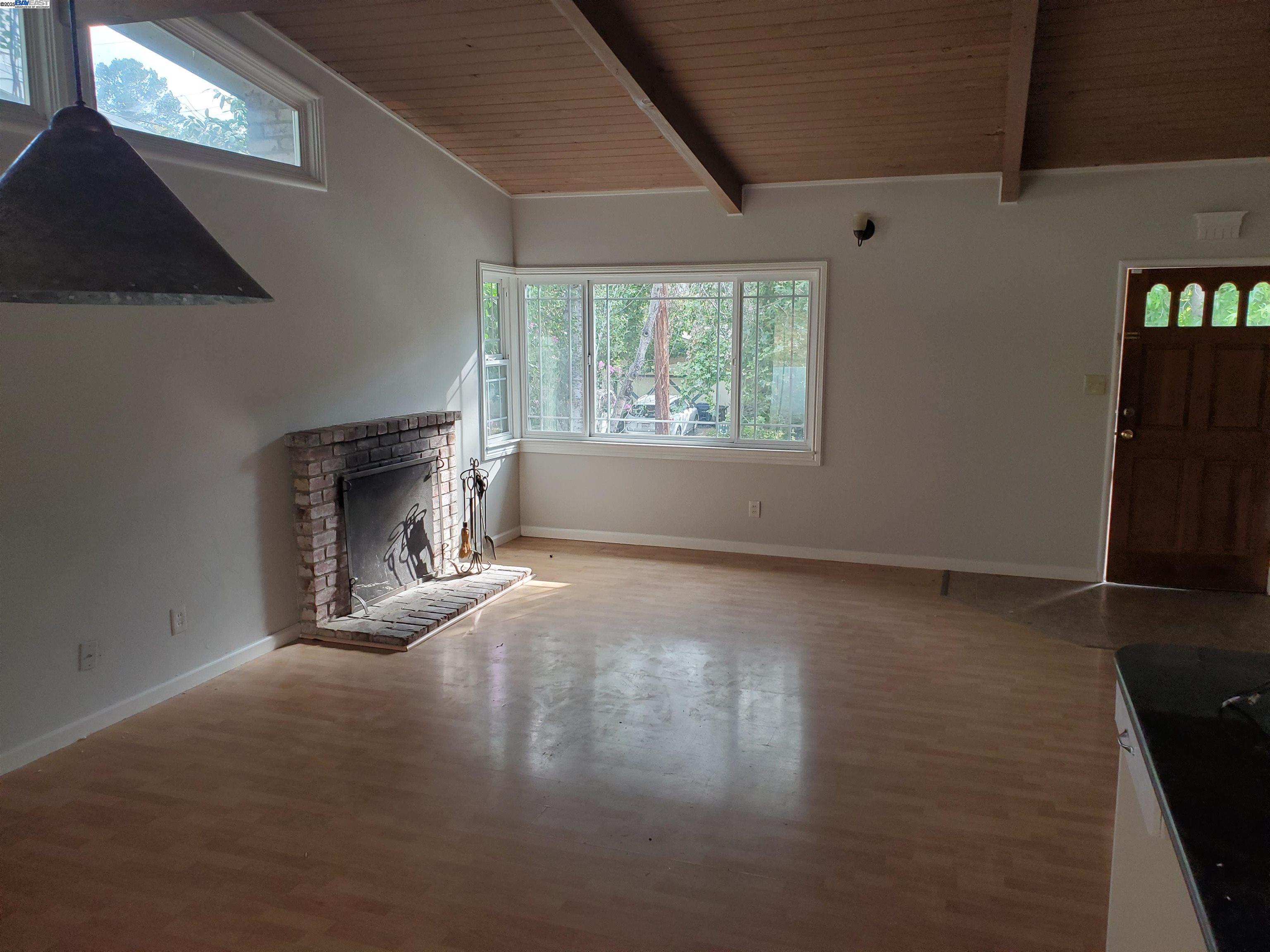 18425 Joseph Drive Castro Valley, CA 94546 - Photo 7 of 24 an empty room with windows and fireplace