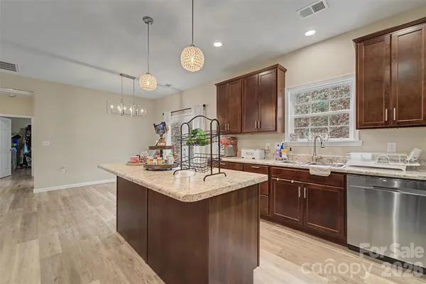 a kitchen with lots of counter space sink and a refrigerator
