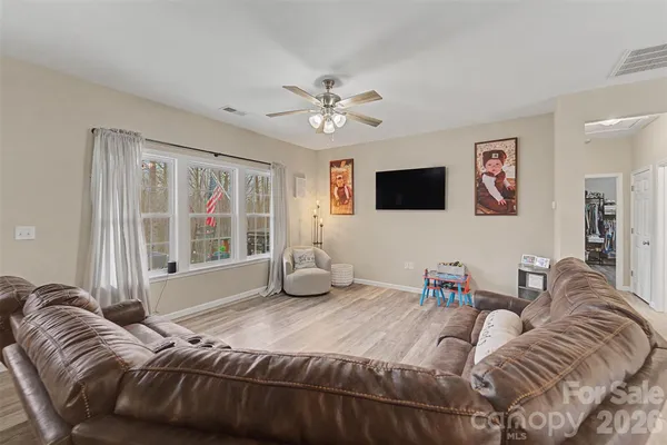 a bedroom with double bed and a window