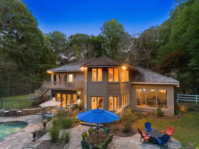 a front view of a house with yard and seating area