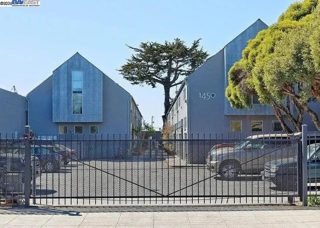 a view of a house with a iron fence