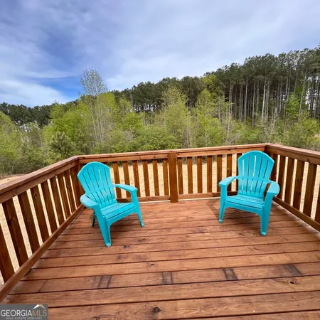 a view of wooden deck with a bench