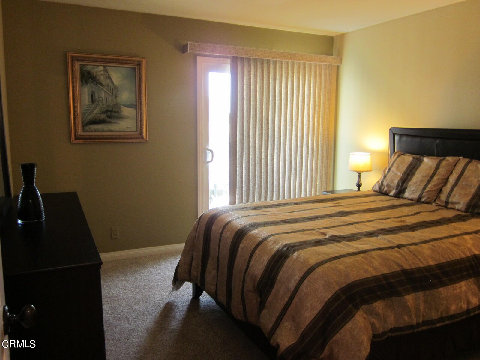 2901 Peninsula Road, Unit 242 Oxnard, CA 93035 - Photo 12 of 20 a bedroom with a bed and a window