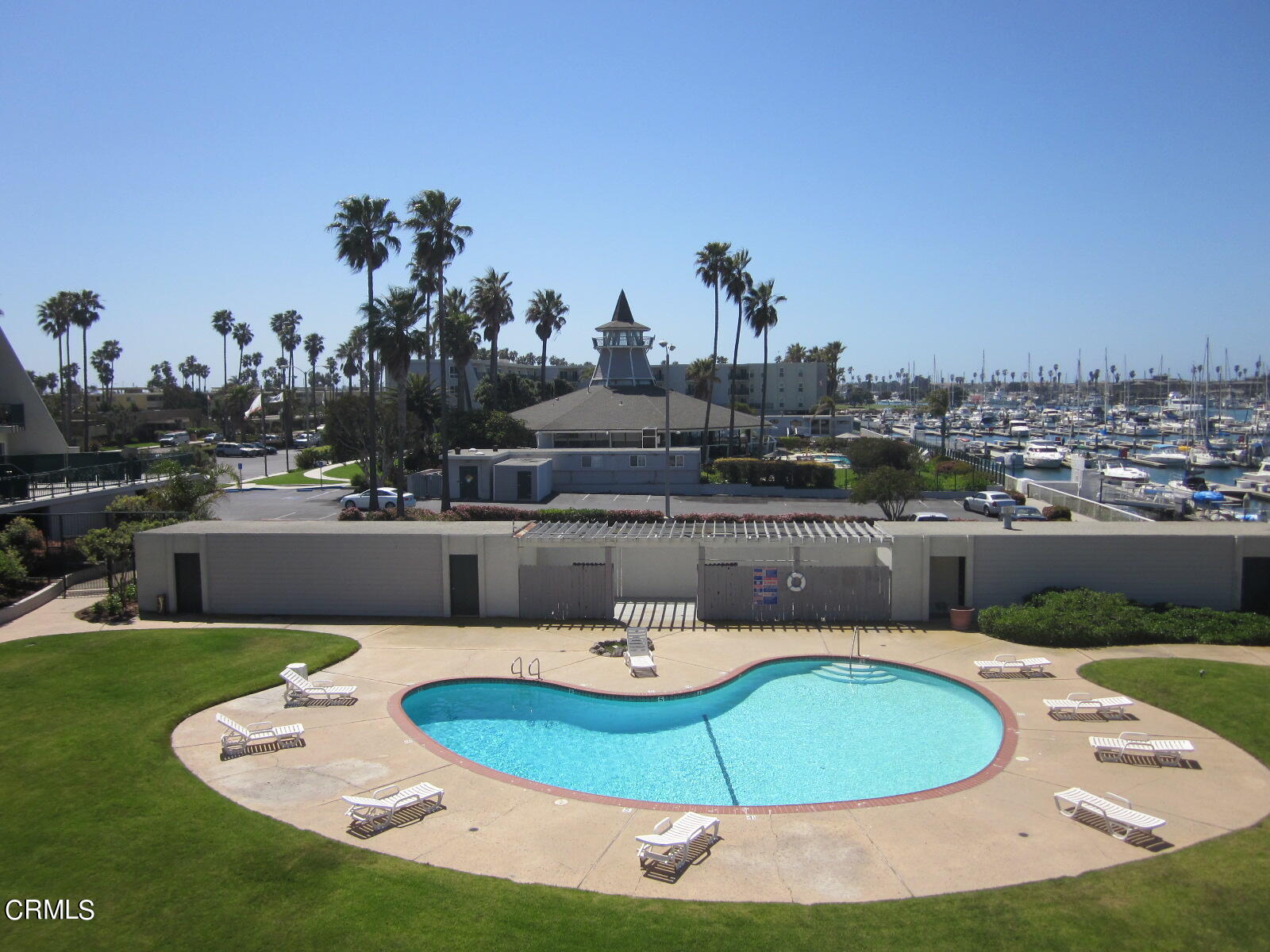 2901 Peninsula Road, Unit 242 Oxnard, CA 93035 - Photo 14 of 20 a swimming pool with outdoor seating and kitchen view