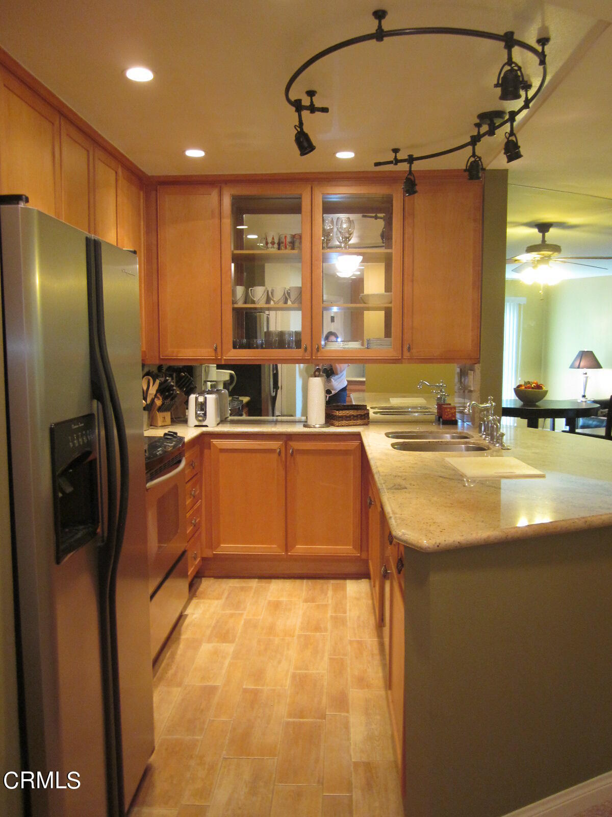 2901 Peninsula Road, Unit 242 Oxnard, CA 93035 - Photo 3 of 20 a kitchen with stainless steel appliances granite countertop a sink a stove and a refrigerator
