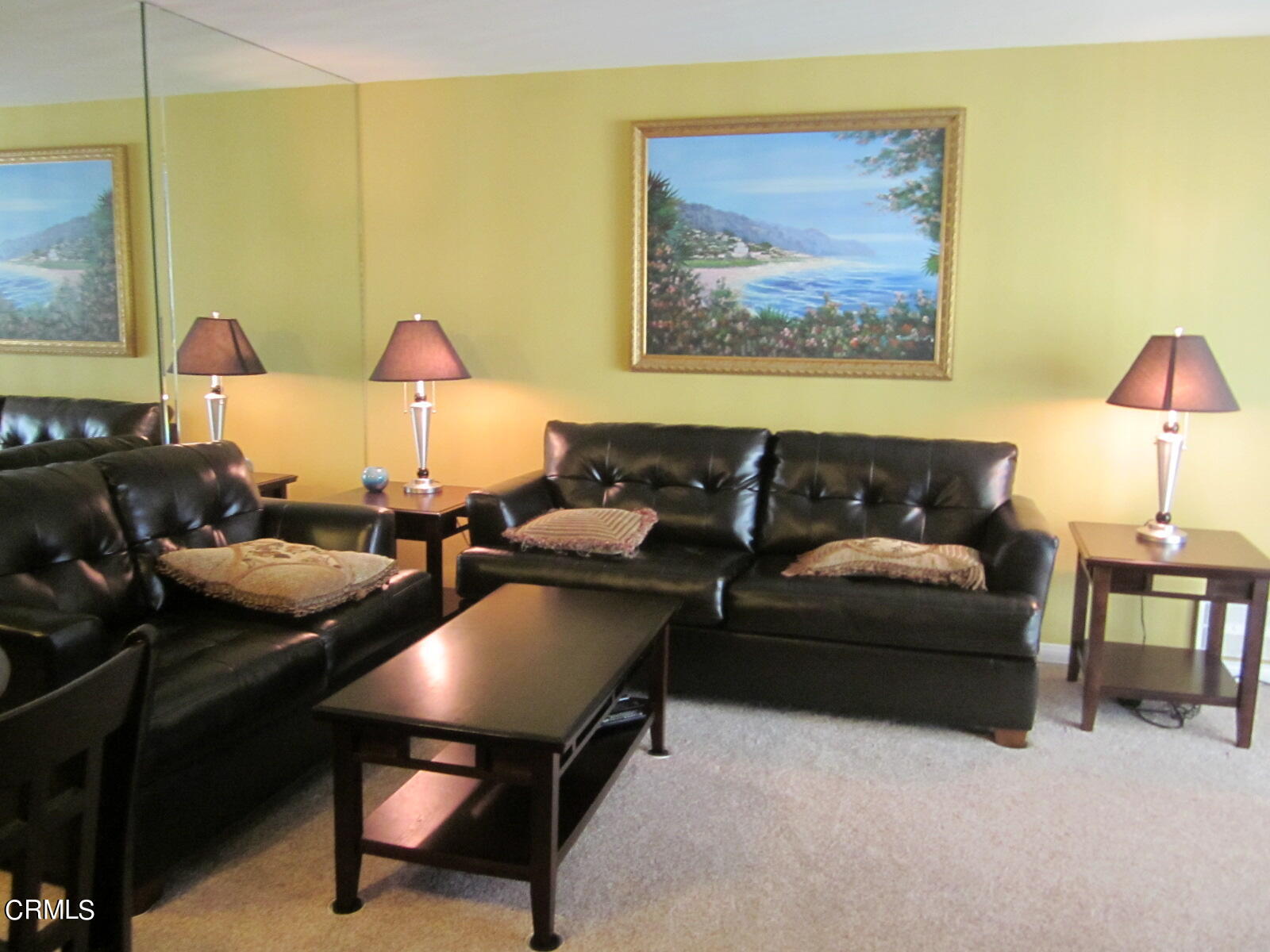 2901 Peninsula Road, Unit 242 Oxnard, CA 93035 - Photo 5 of 20 a living room with furniture and a lamp