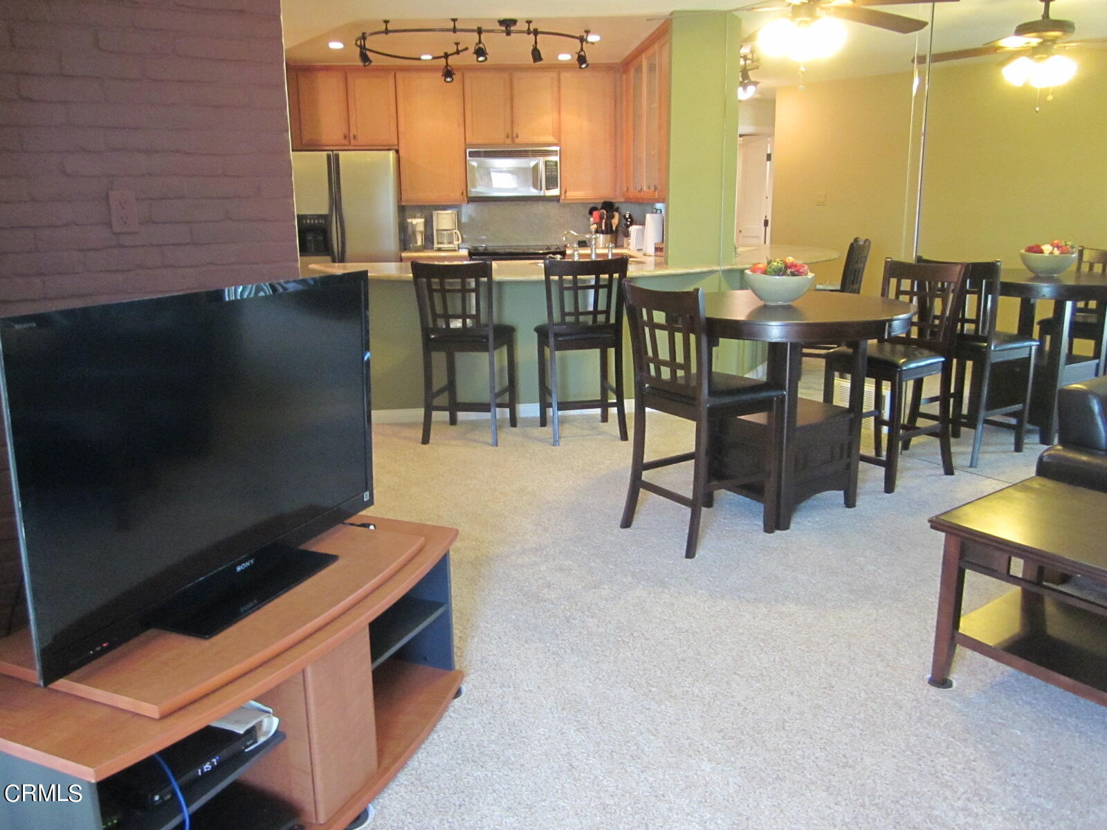 2901 Peninsula Road, Unit 242 Oxnard, CA 93035 - Photo 6 of 20 a view of a patio with a table and chairs