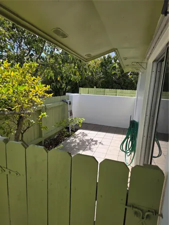 a view of balcony with furniture