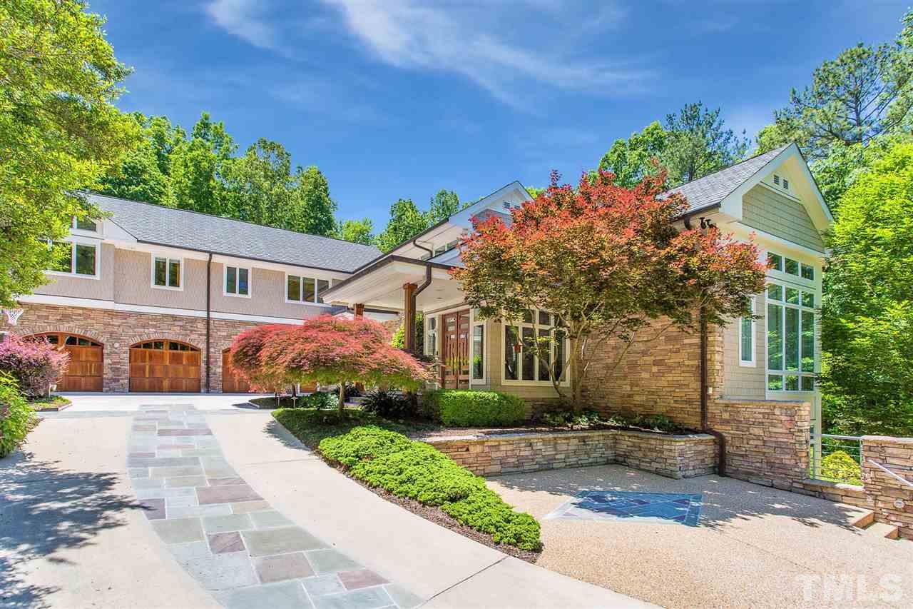 1117 Baslow Brook Court Raleigh, NC 27614 - Photo 2 of 30 a front view of a house with a yard and potted plants