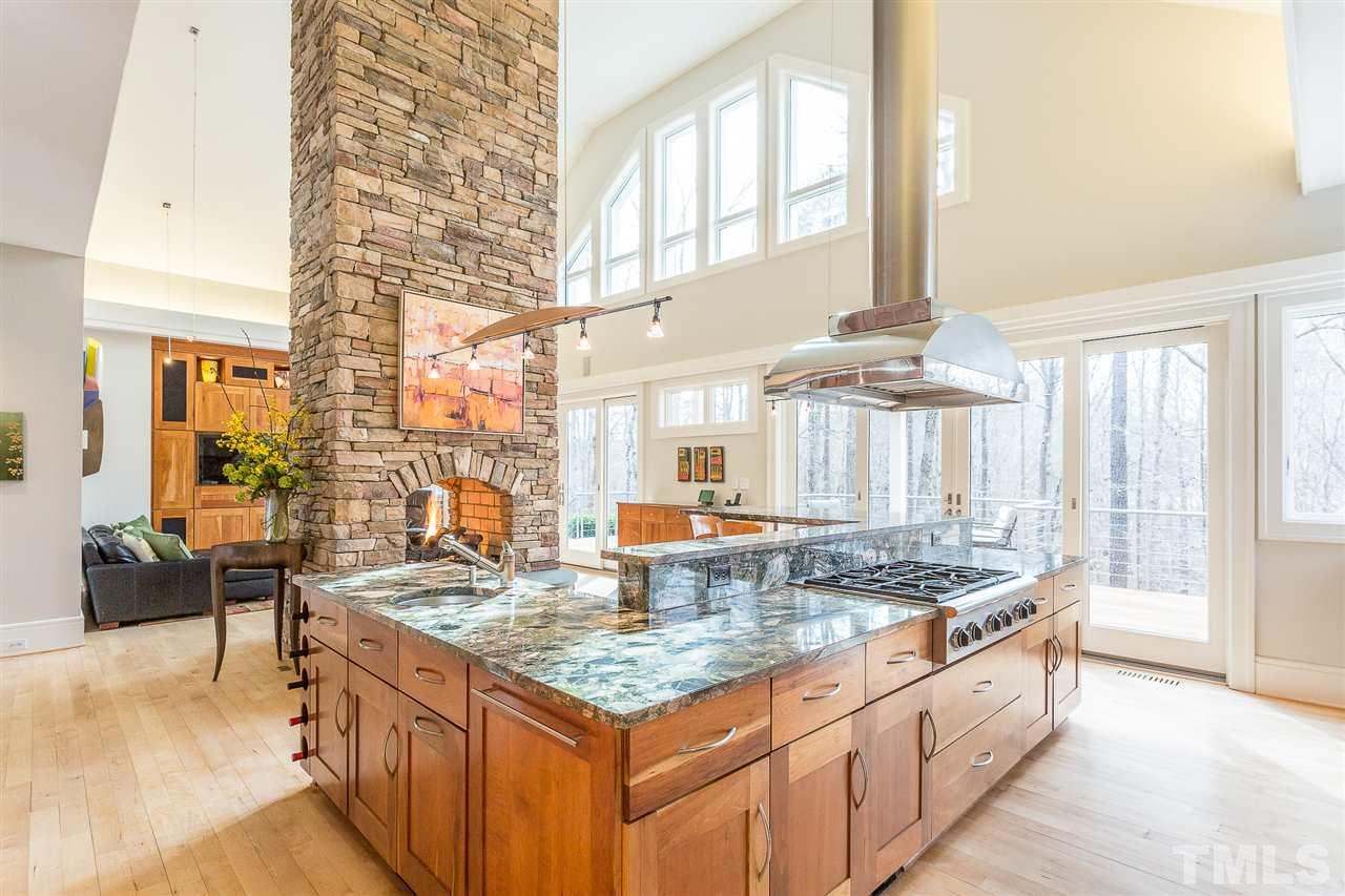 1117 Baslow Brook Court Raleigh, NC 27614 - Photo 12 of 30 a kitchen with granite countertop a sink and a stove