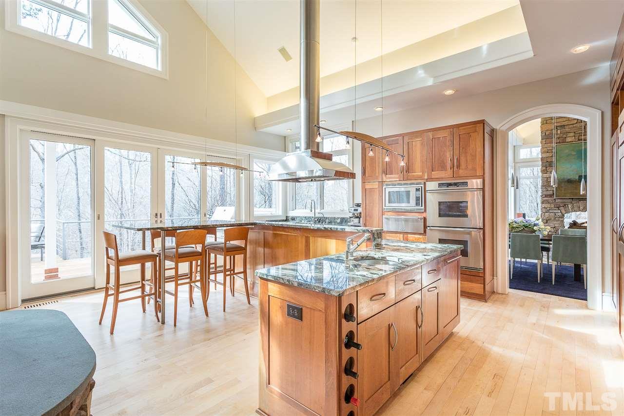 1117 Baslow Brook Court Raleigh, NC 27614 - Photo 13 of 30 a dining table with chairs and a large window