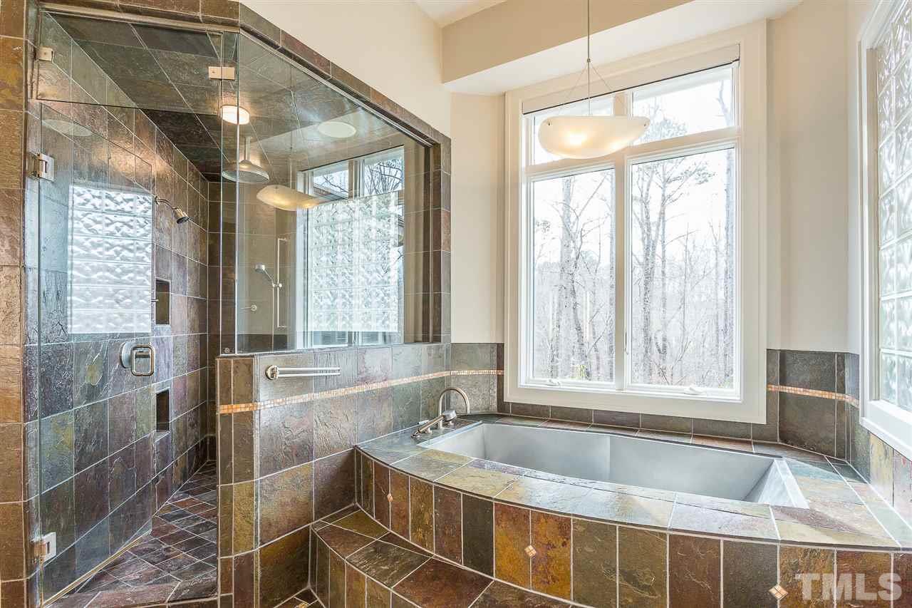 1117 Baslow Brook Court Raleigh, NC 27614 - Photo 19 of 30 a view of a bathroom with tub and windows